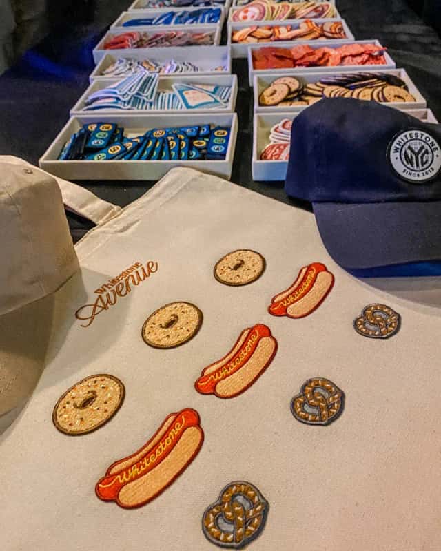 Patch trays and an embroidered tote at a hat and patch bar