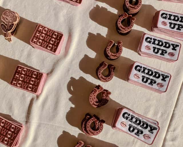 Custom embroidered patches laid out in the sun